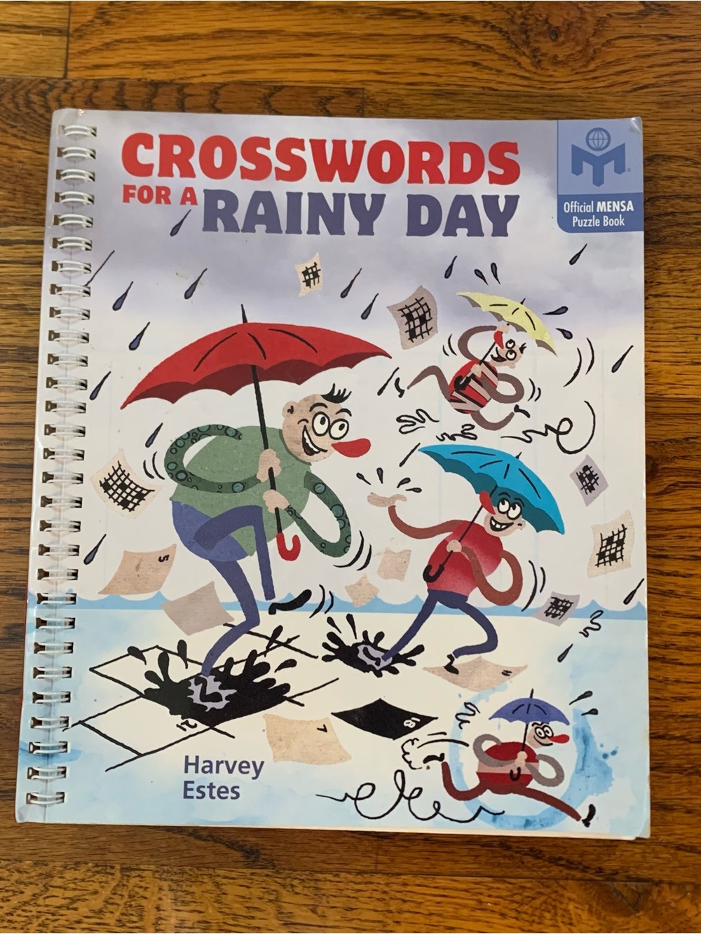 Crosswords for a Rainy Day NWOT
Official MENSA Puzzle Book
96 Pages
Spiral Ring